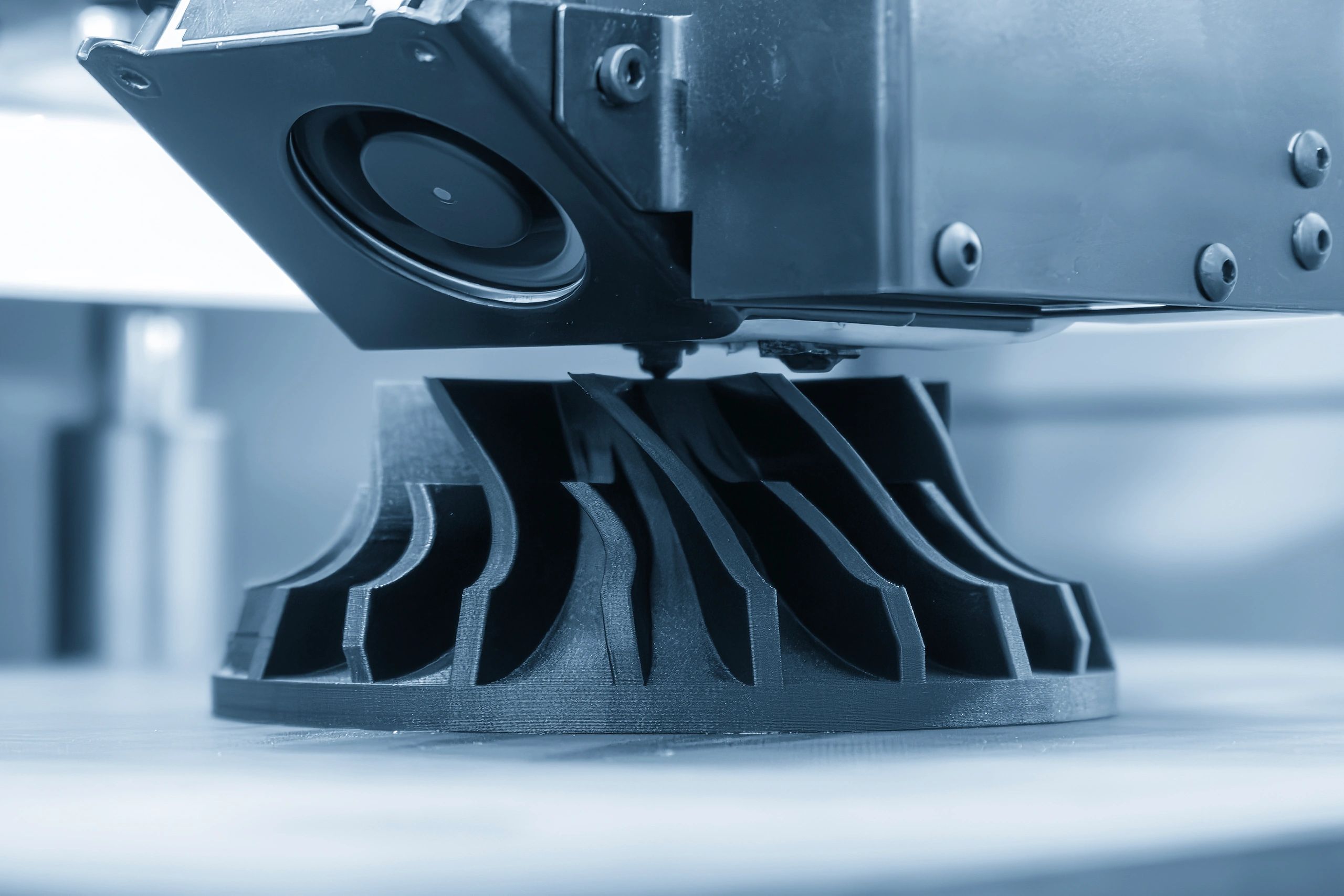 Close-up of a 3D printer manufacturing a prototype part